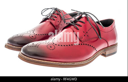 A pair of red wing tip dress shoes on an isolated background Stock Photo