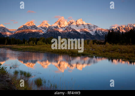 WY02927-00...WYOMING - Sunlight touching the Tetons in the early morning viewed from Schwabacher Landing on the Snake River in Grand Teton National Pa Stock Photo