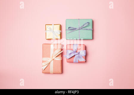 Colorful gift boxes isolated on pink background Stock Photo