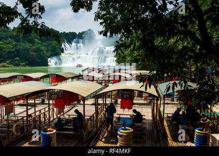 Chongzhuo, China - July 25, 2018: Tourist boats by the Detian Ban gioc waterfalls on China and Vietnam border Stock Photo