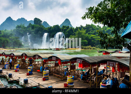 Chongzhuo, China - July 25, 2018: Tourist boats by the Detian Ban gioc waterfalls on China and Vietnam border Stock Photo