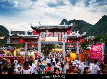 Yangshuo, China - July 27, 2018: Crowded Chinese gate at a popular travel city of Yangshuo near Guilin in Guangxi province of China Stock Photo