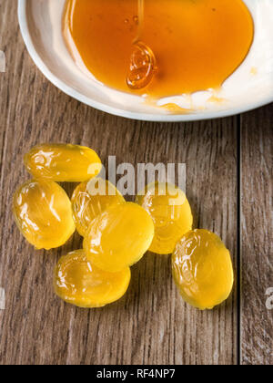 Honey candies on wood background Stock Photo