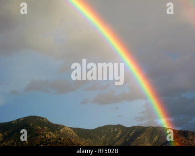 A rainbow appears in Phoenix, Arizona after a rain storm. Stock Photo