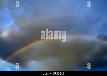 A rainbow appears in Phoenix, Arizona after a rain storm. Stock Photo