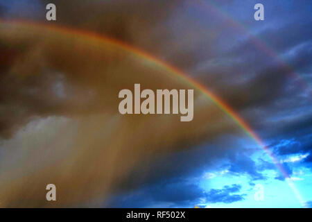 A rainbow appears in Phoenix, Arizona after a rain storm. Stock Photo