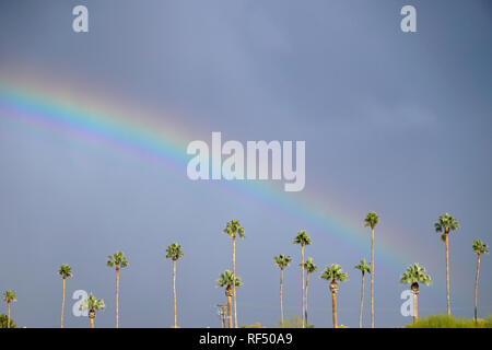 A rainbow appears in Phoenix, Arizona after a rain storm. Stock Photo