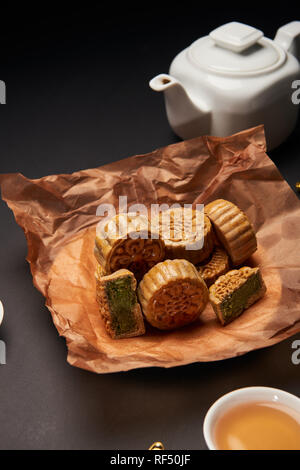 selective focus of traditional chinese mooncakes with tea pot Stock Photo