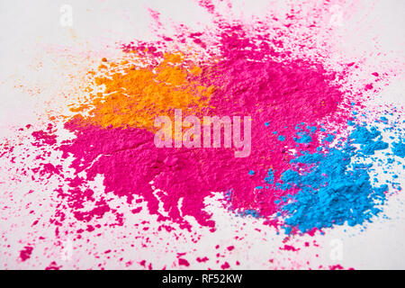 top view of explosion of multicolored holi powder on white background Stock Photo