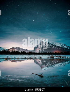 Beautiful night full of stars above Mt Rundle, Vermilion Lakes and Banff town, Banff National Park, Canadian Rockies, Rocky Mountains, Travel Alberta, Stock Photo
