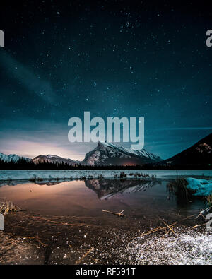 Beautiful night full of stars above Mt Rundle, Vermilion Lakes and Banff town, Banff National Park, Canadian Rockies, Rocky Mountains, Travel Alberta, Stock Photo