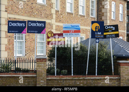 Estate agent To Let boards outside property in SW London, UK Stock Photo
