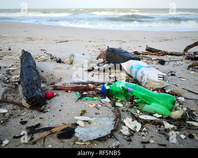 Plastic bottles and other garbage washes up on Songkhla beach. Stock Photo