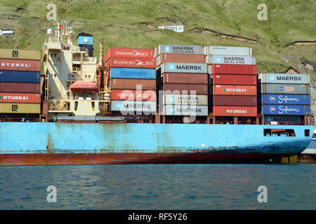 Maersk Line shipping containers on an ocean freight ship in the port of Dutch Harbor, Unalaska Island, Aleutian Islands, Alaska, United States. Stock Photo