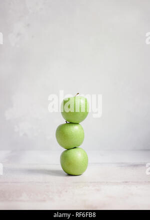Three apples stacked on top of each other Stock Photo