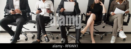 Horizontal image diverse applicants sitting in queue waiting job interview Stock Photo