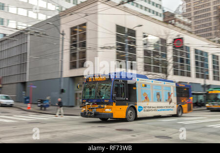 Camera panning of a moving trolley bus in downtown Seattle, Washington, United States Stock Photo