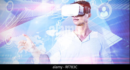 Composite image of man using virtual reality headset Stock Photo