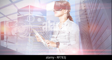 Composite image of female executive using virtual reality headset Stock Photo