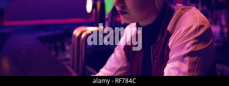 Female bartender using digital tablet at bar counter Stock Photo