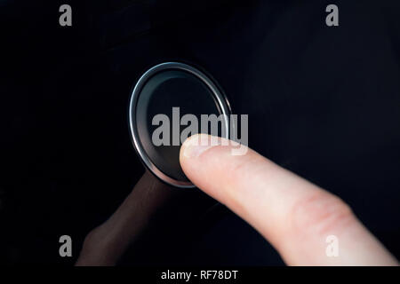 Finger pressing a button Stock Photo