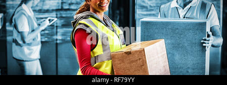Worker is holding goods and smiling to the camera Stock Photo