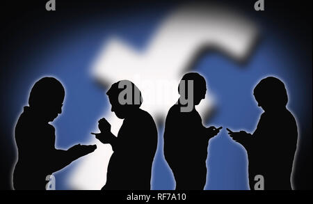 Silhouettes of 4 people using the Facebook app on smartphones to communicate with each other on Social Media. Social networking. Stock Photo