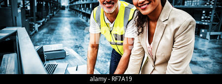 Portrait of warehouse manager and worker working together Stock Photo