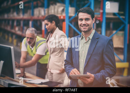 Portrait of manager using digital table Stock Photo