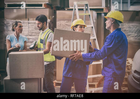 Coworkers looking at each other Stock Photo