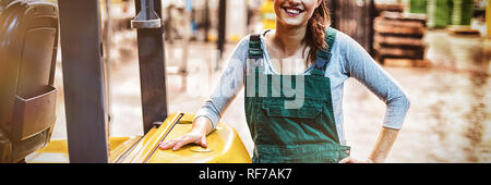Female factory worker standing at drinks production factory Stock Photo