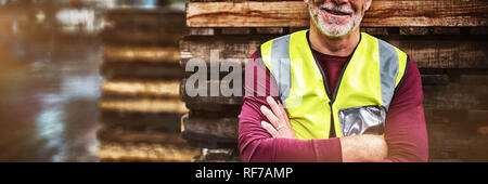 Portrait of male factory worker standing with arms crossed Stock Photo