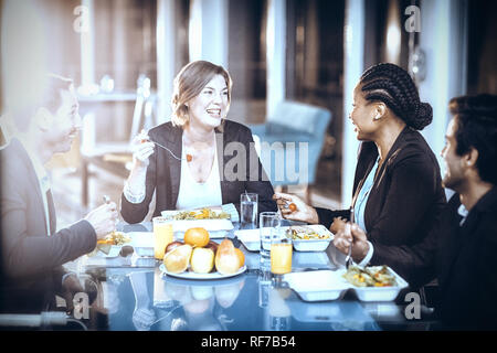 Group of business people having breakfast together Stock Photo