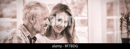 Couple looking in laptop on table Stock Photo