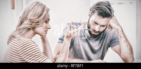 Worried young couple checking on bills Stock Photo