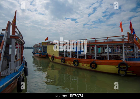 Day boats on the Thu Bon River in Hoi An, Vietnam. Stock Photo