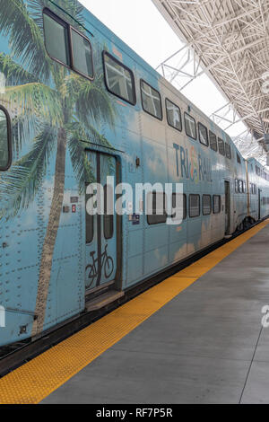The new Tri-Rail station and trains at Miami Airport. The railway route takes passengers north to Fort Lauderdale and beyond to Mangolia Park Station. Stock Photo