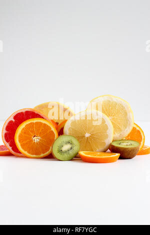 Layers of sliced fruits - kiwi, orange and grapefruits Stock Photo