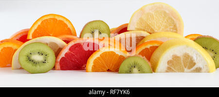 Layers of sliced fruits - kiwi, orange and grapefruits, panoramic crop Stock Photo
