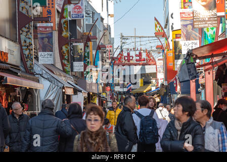 Ameyoko or Ameyayokocho market near Ueno station. One of main shopping street in Tokyo. Text advertise market name and vendor shops including watches Stock Photo