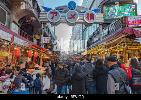 Ameyoko or Ameyayokocho market near Ueno station. One of main shopping street in Tokyo. Text advertise market name and vendor shops including watches Stock Photo