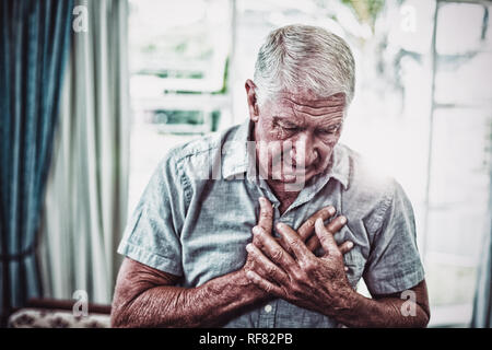 Senior man suffering from chest pain Stock Photo