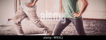 Seniors doing sport exercises Stock Photo