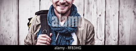 Young man carrying backpack Stock Photo