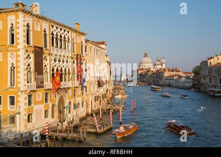 Water taxis and vaporetto on Grand Canal with Renaissance architectural style palace buildings in San Marco and Santa Maria Stock Photo