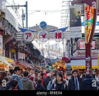 Ameyoko or Ameyayokocho market near Ueno station. One of main shopping street in Tokyo. Text advertise market name and vendor shops including watches Stock Photo