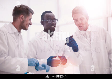promising scientist makes notes on the Board Stock Photo