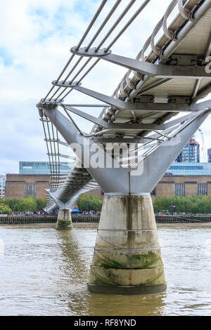 The Millennium Bridge viewed from below, looking South to Bankside and Tate Modern, London, UK Stock Photo