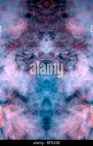 A background of pink, red and white wavy smoke in the shape of a ghost's head or a man of mystical appearance on a black isolated ground. Bright abstr Stock Photo