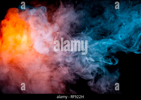 Background of orange, purple, red and blue wavy smoke on a black isolated ground. Abstract pattern of steam from vape of smoothly rising clubs. Stock Photo